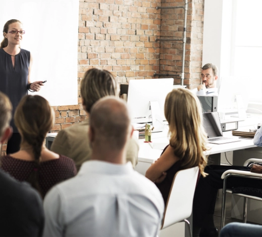 lady delivering crisis communications training to a room of people