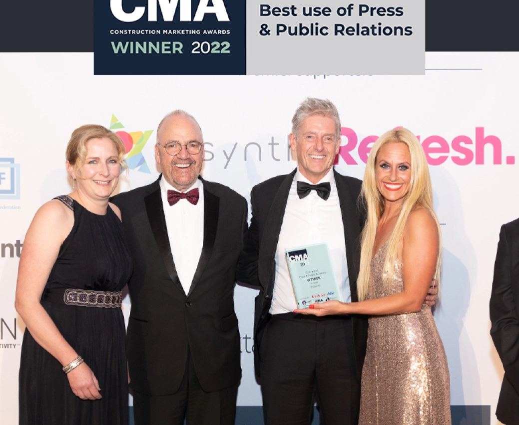 Ella Brocklebank, Martin Sandall of Jenner are stood alongside Fabrick's Colin Felton collecting their Best Use of PR awards at the 2022 Construction Marketing Awards
