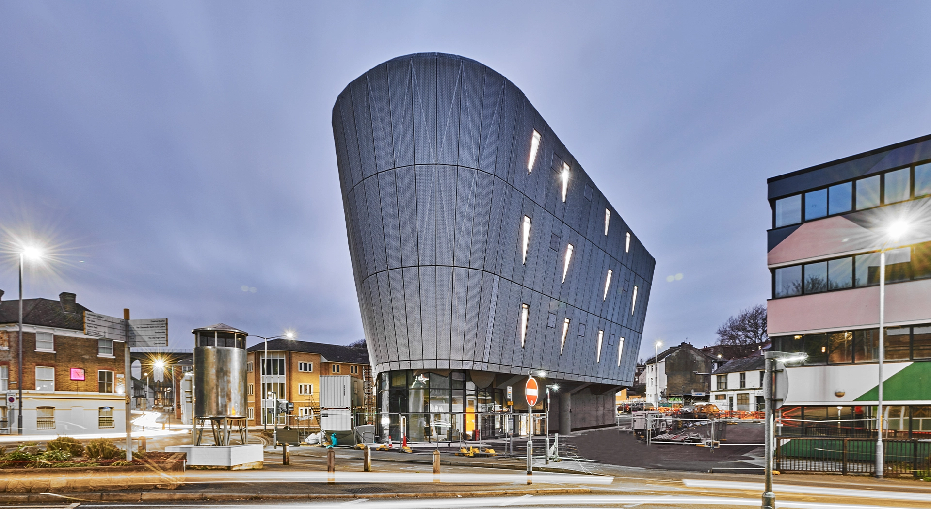 Image of a laptop screen showing some PR coverage Fabrick's construction PR team achieved for Jenner Group on the F51 skatepark project and a photo of the exterior of F51 in Folkestone, Kent