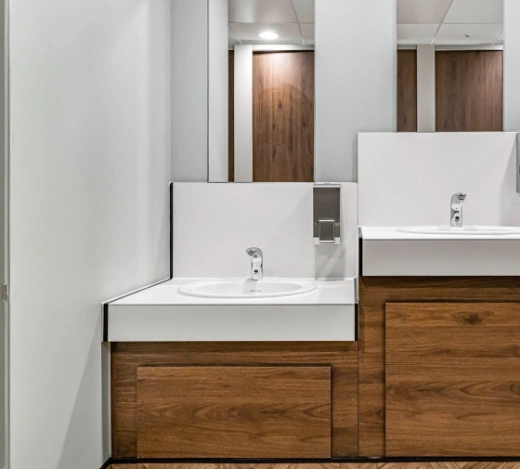 Venesta toilets and washrooms sitting alongside a computer screen showing Fabrick's PPC results