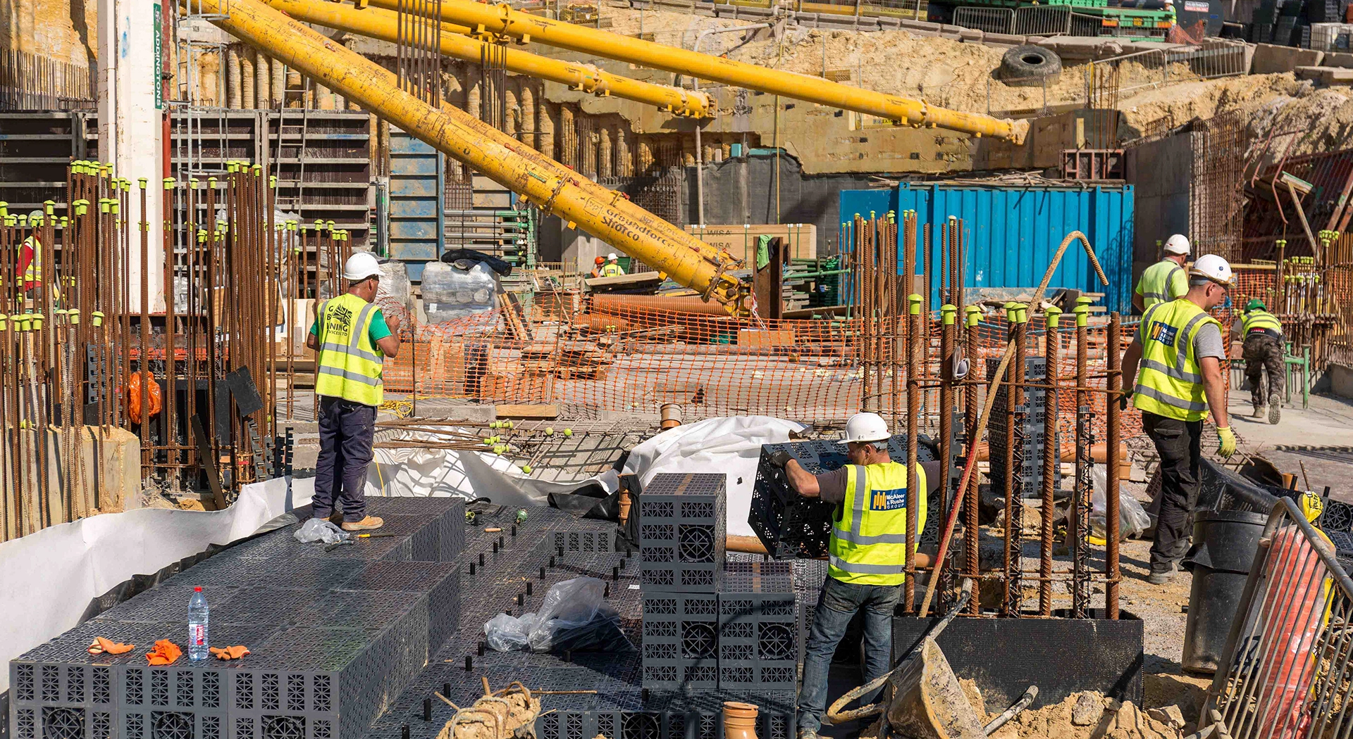 Publication showing a PR feature for Wavin and a building site with two site workers wearing PPE